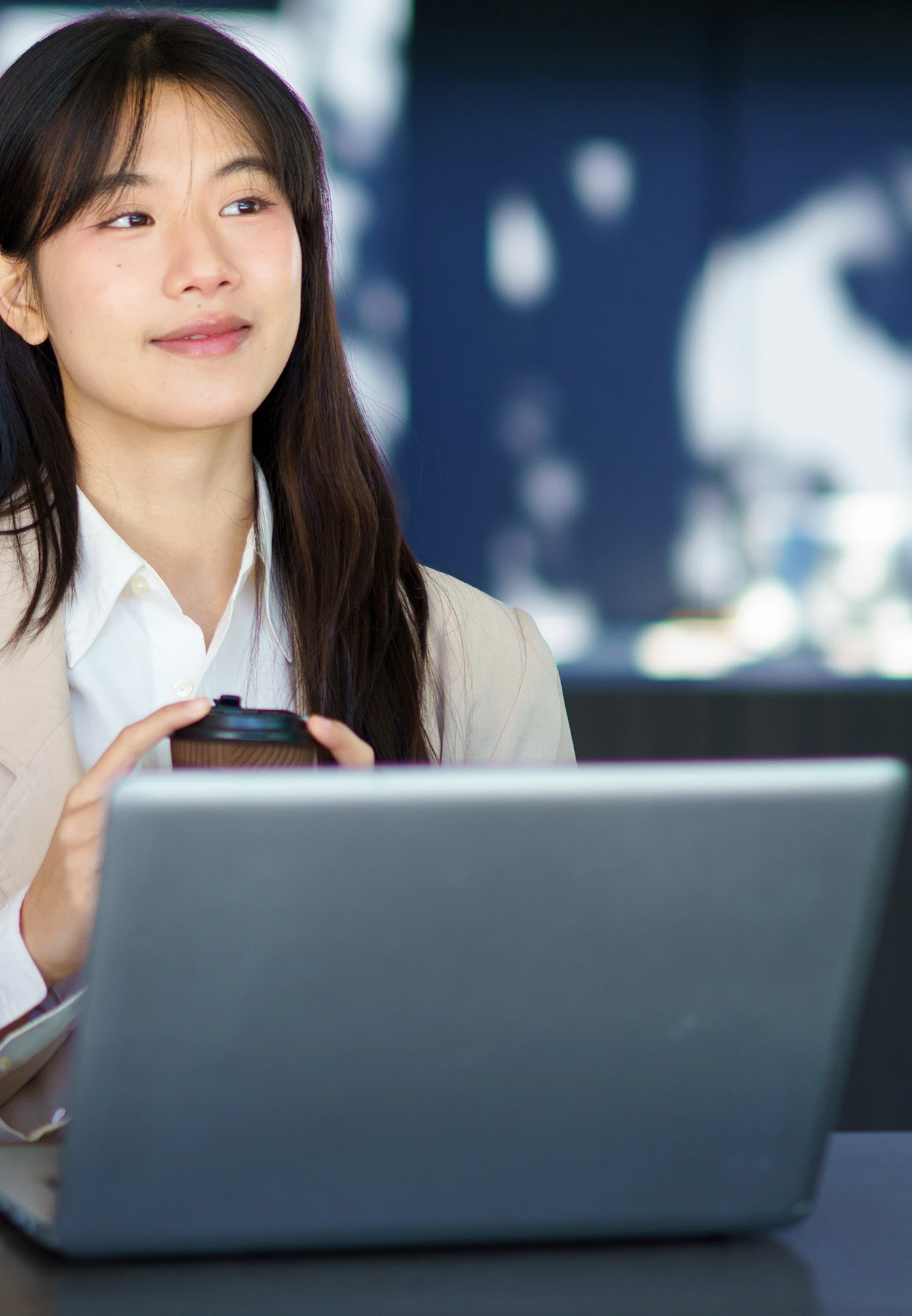 person working on a table with laptop
