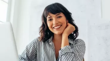 A professional woman smiling.
