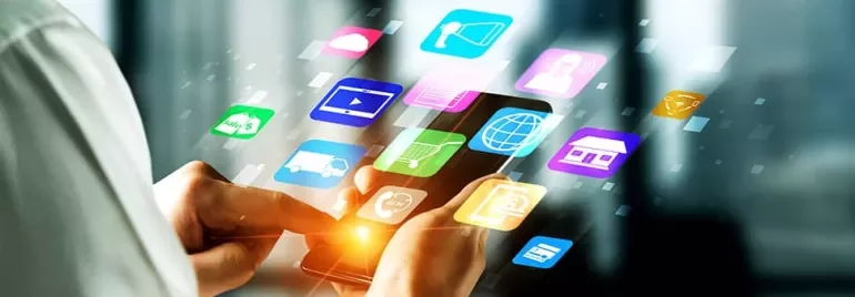Person using smartphone with colorful app icons floating above.