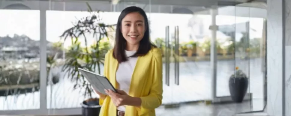 A professional smiles showing confidence in asking for a pay rise