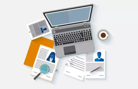 Office desk with laptop, resumes, tablet, coffee, and stationery.
