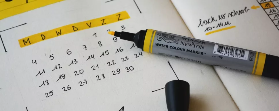 Calendar marked with a yellow highlighter and a note about back to school.